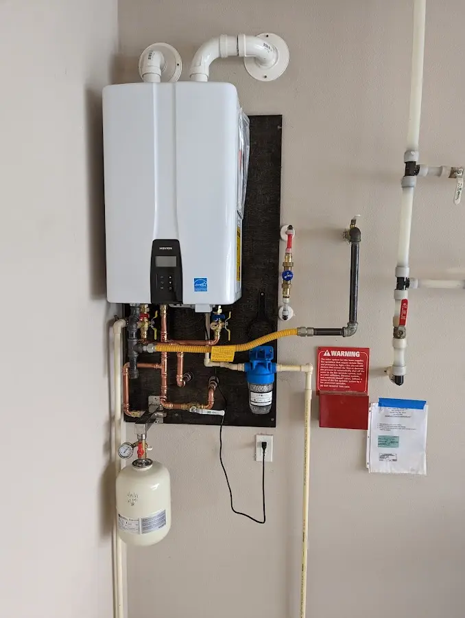 Professional plumber installing copper piping in a Tamalpais-Homestead Valley home